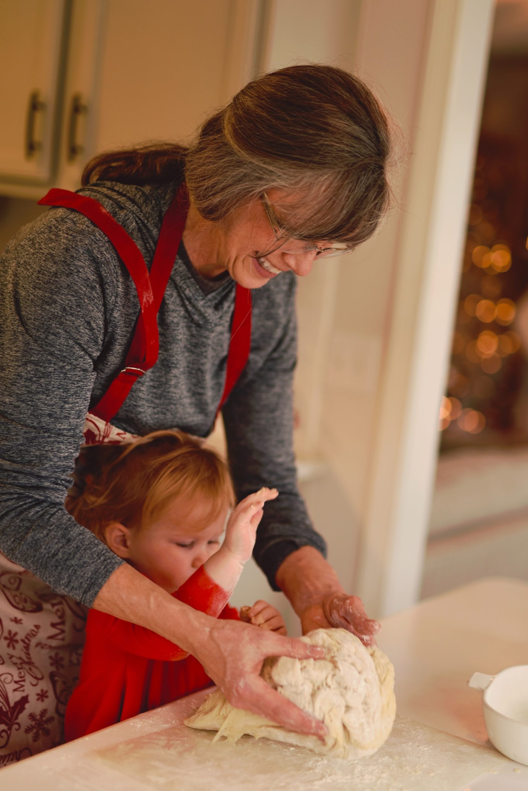 Grandma & grand daughter baking image Bioflex laser practitioner at Karen J Millers chiropractic