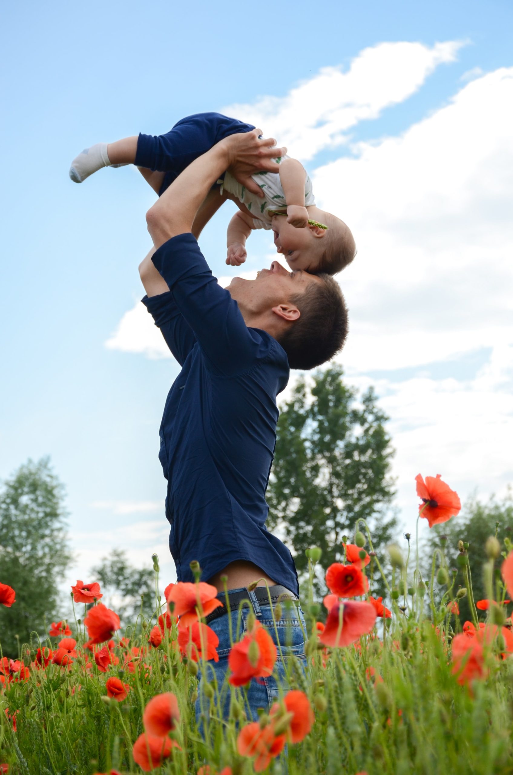 father son in poppy field image Bioflex laser practitioner at Karen J Millers chiropractic